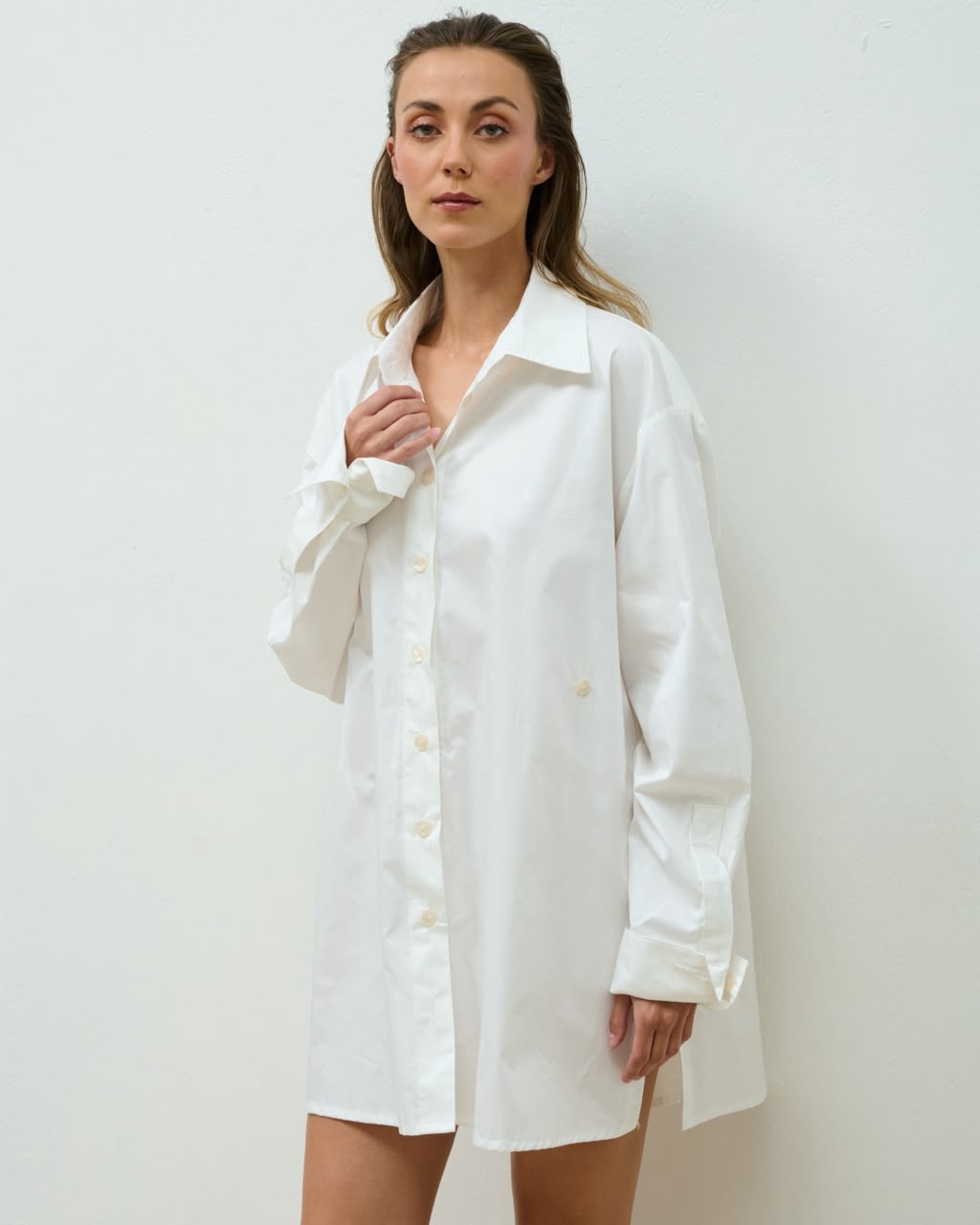 Model wearing the white oversized Maira Shirt, front view
